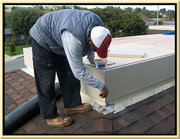 we serve mission viejo with roofing services a roofer patching a roof where we fixed a roof